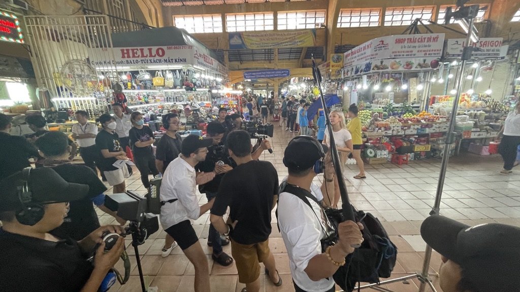 Documentary — crew filming in a Saigon market on the EQUO shoot